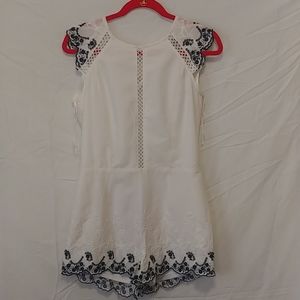 White romper with lace trim pattern